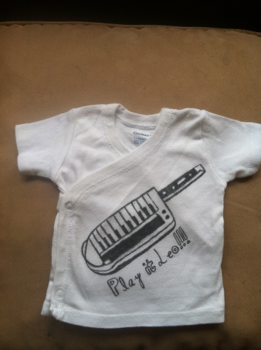 This is a shirt I made for Baby Keytar! It is a keytar and it says "Play it Leo!" (Another Phish reference)